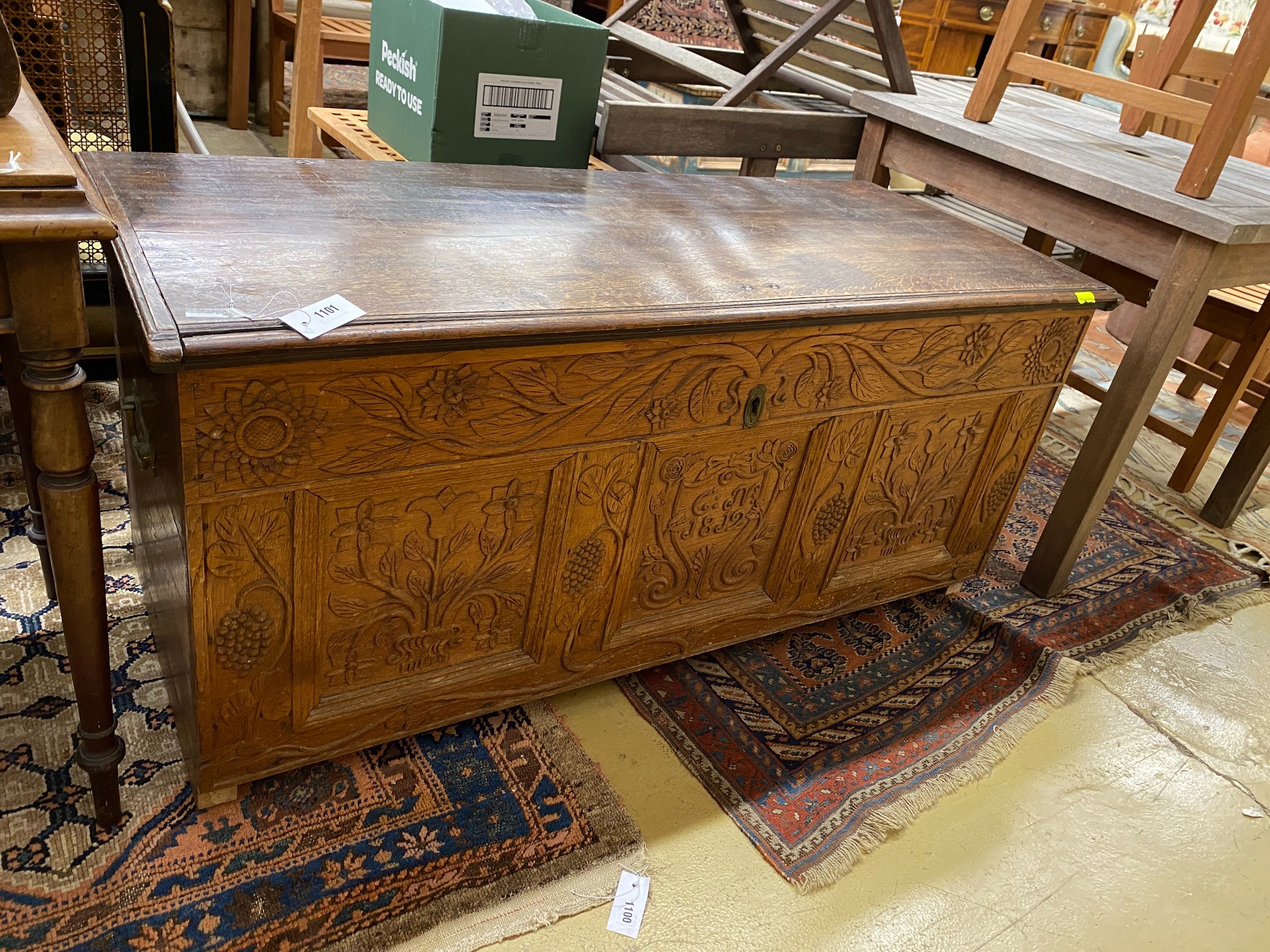 An 18th century and later carved oak coffer, length 134cm, depth 56cm, height 61cm